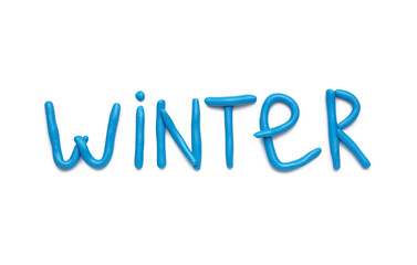 Word WINTER made of play dough on white background