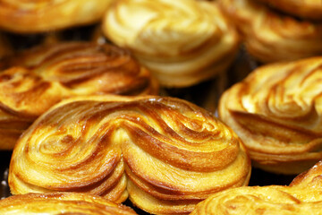 Puff pastry closeup. Freshly baked rolls for breakfast