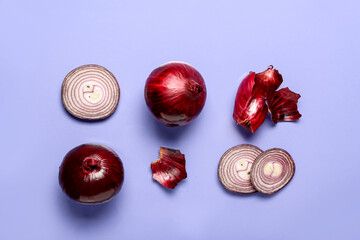 Fresh red onions on blue background