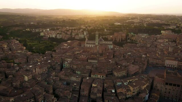 Aerial of old town Siena skyline and city center at sunset in Tuscany, Italy 10