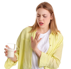 Young woman with lactose intolerance refusing to drink milk on white background
