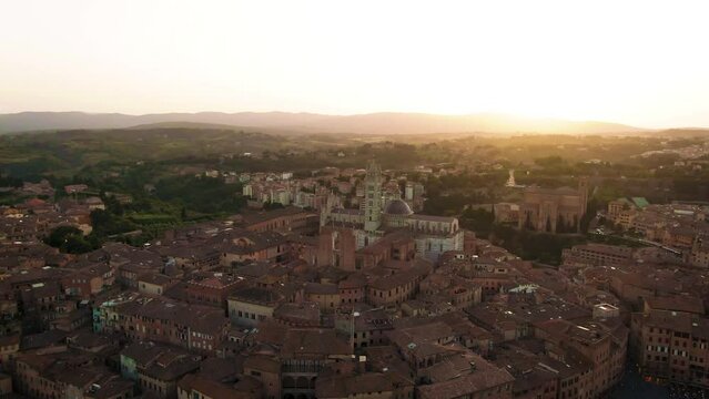 Aerial of old town Siena skyline and city center at sunset in Tuscany, Italy 3