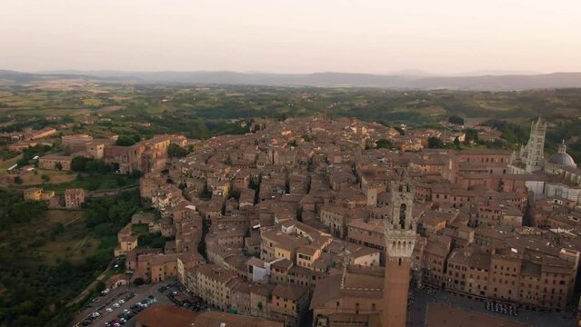 Aerial of old town Siena skyline and city center at sunset in Tuscany, Italy 2