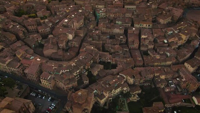 Aerial of old town Siena skyline and city center at sunset in Tuscany, Italy 1