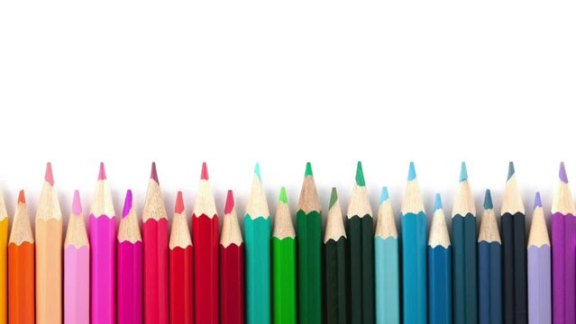 Movement of colored pencils on a white background.