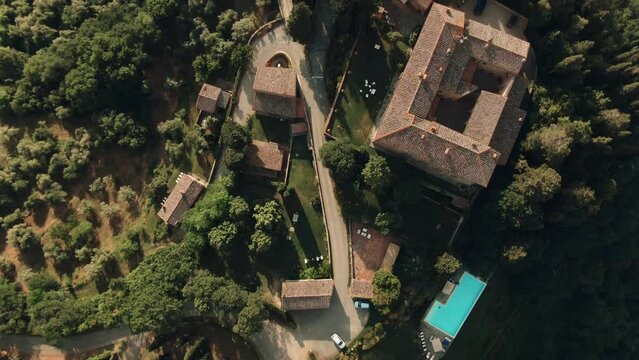 Aerial of private Tuscan villa castle on a hilltop in the country side, Tuscany, Italy 3
