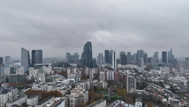 Aerial perspective captures the energy of La Défense under clouds.
