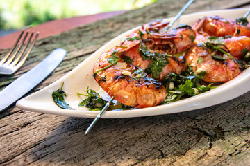 tasty fresh shrimp skewers on plate