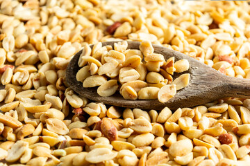 peeled peanuts, without skin, in a metal baking dish