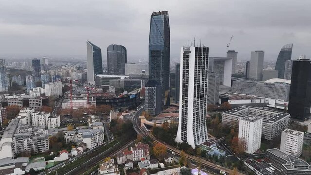 Aerial view of La Défense on a cloudy afternoon showcases its modernity.
