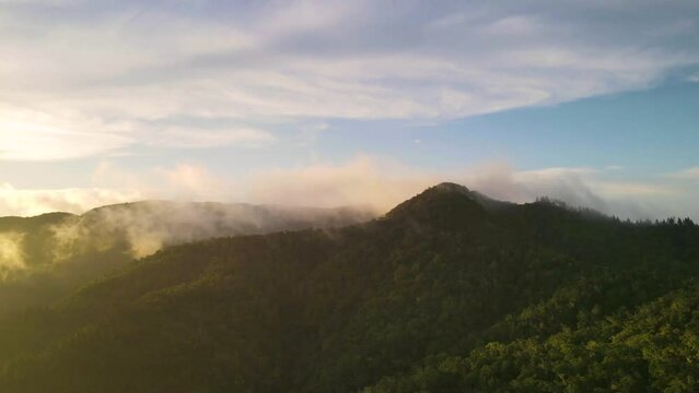 Time lapse aerial footage of the misty mountains at sunrise, beautiful nature scenery