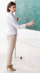 Female math teacher in front of the chalkboard