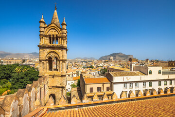 Fototapeta na wymiar Palermo Cathedral, view of tower with cityscape from roof of cathedral, a major landmark and tourist attraction in capital of Sicily, Italy, Europe.