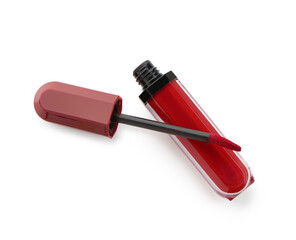 Bright red lipstick with brush on white background