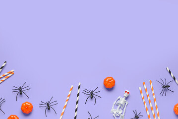 Composition with Halloween decorations and paper drinking straws on color background