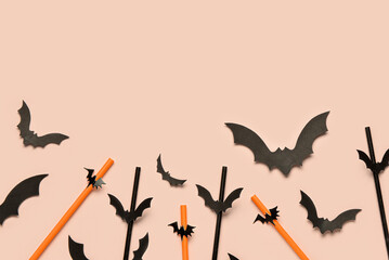 Composition with paper drinking straws and Halloween decorations on color background