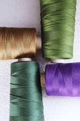 Multicolored cotton yarn or thread on coils. Multicolored yarn. Flat lay. Top view. Copy space.