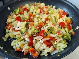 Colorful vegetables cooked in wok - home cooking