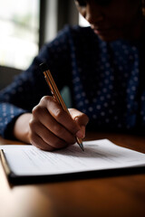 person signing a document