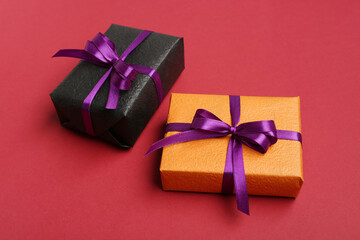 Gifts for Halloween celebration on red background