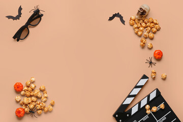 Composition with tasty caramel popcorn, clapperboard, 3D glasses and Halloween decor on beige background