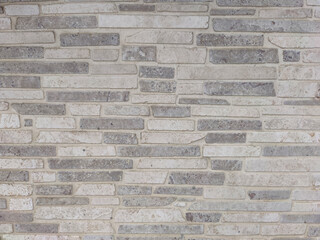 wall made of thin rectangular stones, copy space