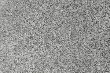 Terry cloth, gray towel texture background. Soft fluffy textile bath or beach towel material. Top view, close up.