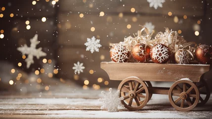 Fotobehang Snowflakes falling on vintage sleigh with Christmas backdrop © Matthias