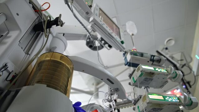 Artificial lung ventilation machine. Pump is working during operation. Diverse equipment in surgery room. Low angle view.