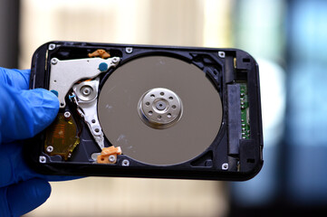 Laptop 2.5 inch hard disk drive storage memory, repair broken computer part, a close up view of an...