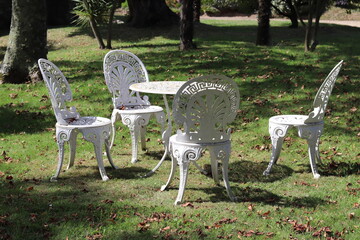 white table and chairs in garden