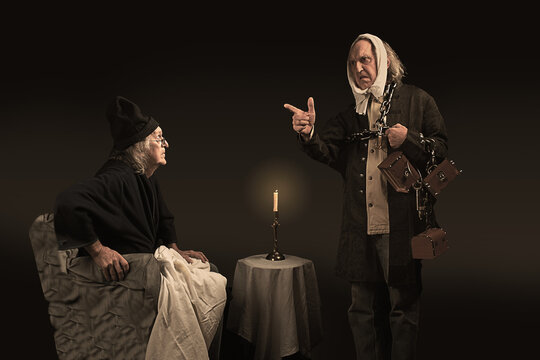 Ebenezer Scrooge having a discussion with the ghost of Jacob Marley, his deceased business partner