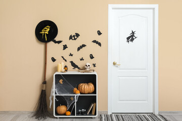 Interior of hall decorated for Halloween with door and shelf unit
