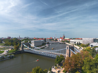 Summer panoramic cityscape of Wrocław, Poland, with a Grunwald Bridge (Most Grunwaldzki) in the foreground