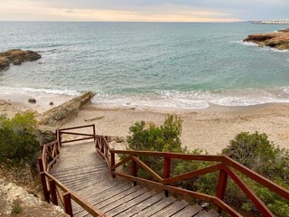 Wooden descent to the sea, lagoon with clear water, Spain, Alcossebre, Castellon