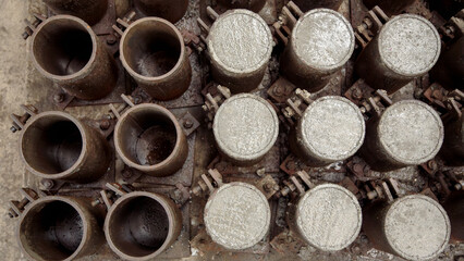 Overhead view of concrete test cylinders in molds, industrial pattern © imarginarium