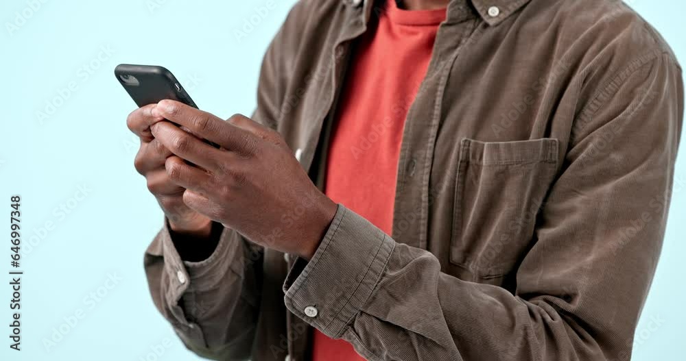 Poster Hands, smartphone and man typing in studio isolated on blue background. Phone, closeup and person scroll on internet search app, social media networking and online communication on digital technology
