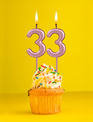 Number 33 candle - Birthday card design in yellow background