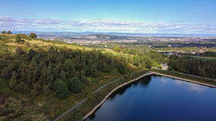 Edinburgh cityscape and Torduff Reservoir view. Torduff Reservoir and Maiden s Cleugh Circular. Discover this 9.7-km circular trail near Edinburgh, Scotland