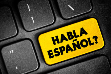 Habla Espanol? text button on keyboard, concept background