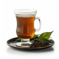 A cup of tea and leaves on a plate