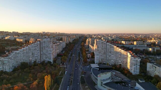 Panoramic aerial drone view of City Gates of Chisinau in Boulevard. View of road, trees, park, lake, buildings of Chisinau at autumn season, capital city of Republic of Moldova. 4K video