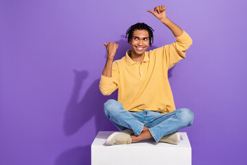 Full body photo cadre of smiling youth student man indicate fingers empty space proposition cafeteria isolated on violet color background