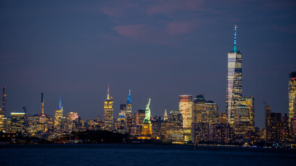 Obraz premium NYC and New Jersey city skyline with Liberty statue