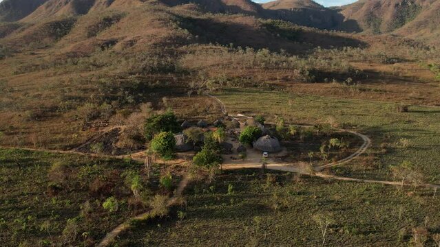 aerial view village in Chapada dos Veadeiros "Aldeia Macaco" hollow-shaped bioconstruction houses cerrado landscape Goi&aacute;s Brazil