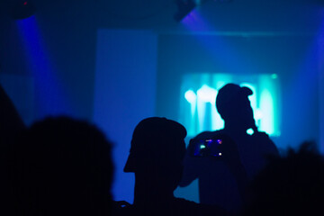 silhouette of people dancing on stage