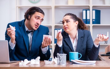 Two employees suffering at workplace