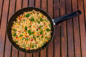 Pan of rice with vegetables