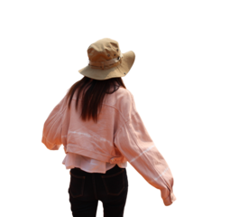 The back of a young woman wearing a hat is walking, isolated object, transparent background