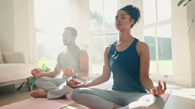 Yoga, lotus and couple for home meditation, zen fitness and exercise or mindfulness, healing and peace in living room. Calm, breathing and relax people with health, holistic training or body wellness